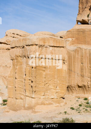 Hand carved stone Djinn blocks marking the entrance to tombs in Petra Jordan, the ancient Nabataean city of Raqmu. Stock Photo