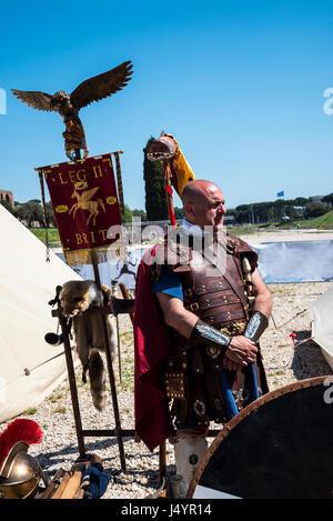 Re-enactors and artifacts at the celebration of the birthday of the city of Rome on the Circus Maximus Grounds in Rome Italy Stock Photo