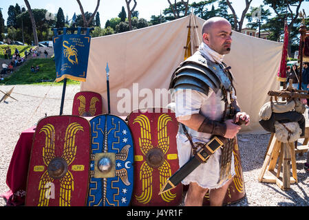 Re-enactors and artifacts at the celebration of the birthday of the city of Rome on the Circus Maximus Grounds in Rome Italy Stock Photo