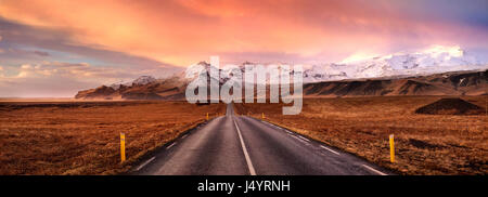 Horizon road and the snow covered mountains, Iceland Stock Photo
