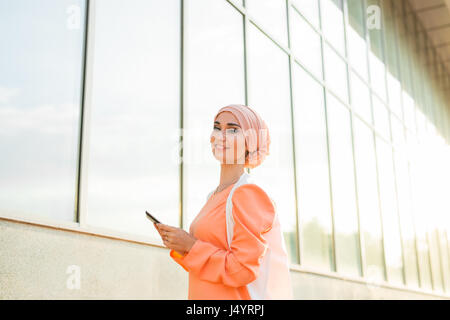 beautiful arabian girl with tablet computer. Muslim woman. Stock Photo