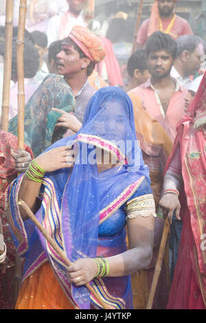 People celebrating lathmar holi festival, mathura, uttar pradesh, india, asia Stock Photo