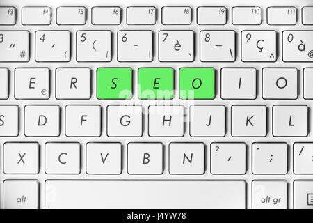 Word SEO written on a white computer keyboard, search engine optimization concept, internet website ranking or online marketing Stock Photo