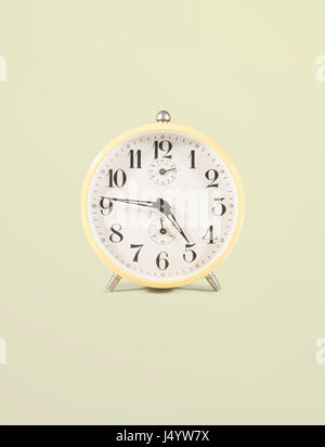 isolated retro alarm clock on white background Stock Photo