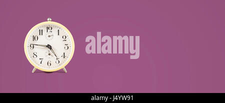 retro alarm clock header on colored background Stock Photo
