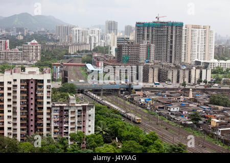 Local train passing at kanjurmarg station, mumbai, maharashtra, india, asia Stock Photo