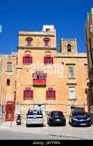 The Bridge bar building along Liesse with a red British telephone box to the left, Valletta, Malta, Europe. Stock Photo