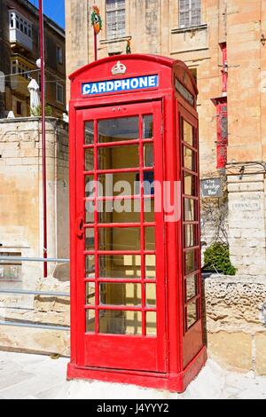 Traditional British red telephone box along Liesse with the Bridge Bar to the rear, Valletta, Malta, Europe. Stock Photo