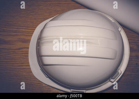 white safety helmet with drawings, engineering concept Stock Photo
