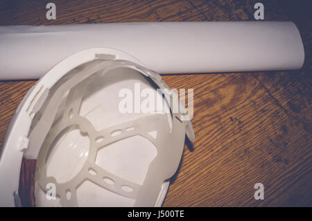white safety helmet with drawings, engineering concept Stock Photo