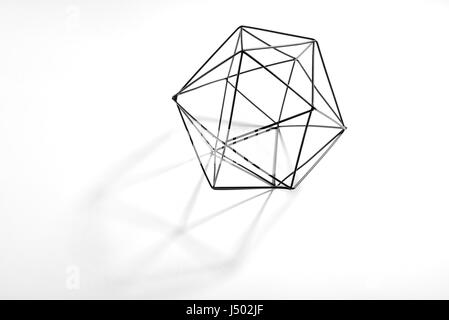 Geometric solid on white background with shadow Stock Photo