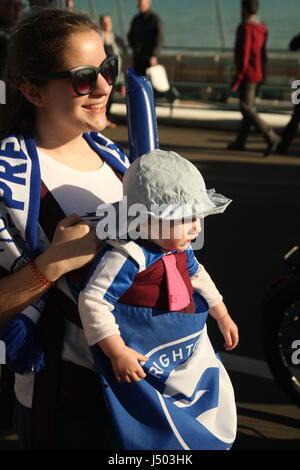 Brighton, UK. 14th May 2017.  This baby came out to show its support when fans of Brighton and Hove Albion Football Club Came out in their thousands to watch the team's bus-top parade along the city's coast road. Team and fans were celebrating promotion to the Premiership. Roland Ravenhill/ Alamy Live News Stock Photo