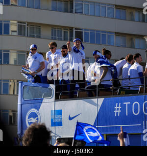 Brighton & Hove, East Sussex, UK, 14 May 2017. Brighton & Hove Albion Football Club parade in open-top buses along Brighton & Hove seafront after securing promotion to the Premier League by finishing second in the Championship. This is the first time since 1983 that Brighton & Hove Albion will play in England's top division. Credit: Clive Jones/Alamy Live News Stock Photo