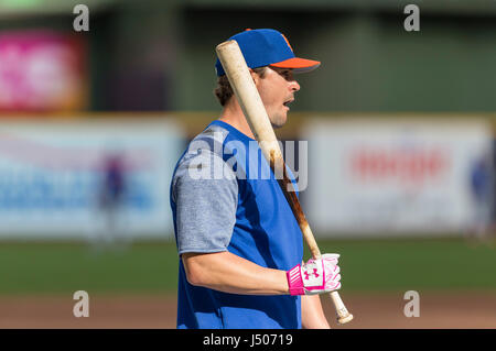 The batting gloves worn by New York Mets' Pete Alonso are seen as he waits  in the dugout to bat during the first inning of a baseball game against the  Cincinnati Reds