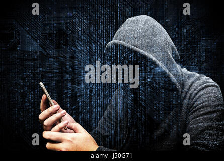 Double Exposure of hooded cyber crime hacker using mobile phone internet hacking in to cyberspace,online personal data security concept.Matrix code ba