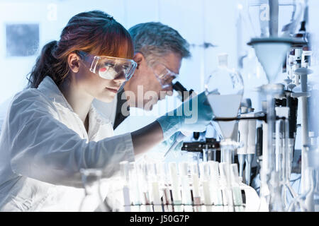 Health care researchers working in scientific laboratory. Stock Photo
