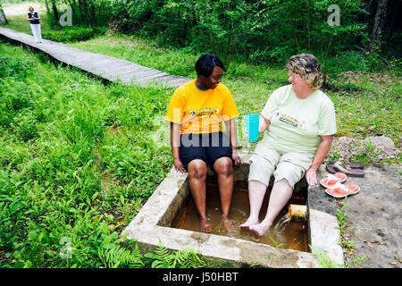 Alabama,Millry,Healing Springs,Black woman female women,holistic,mineral,water,soak,therapeutic,feet,AL080514049 Stock Photo