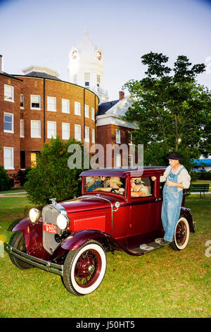 Monroeville Alabama,Courthouse Square,mule,wagon,Old Monroe County Courthouse 1903,To Kill a Mockingbird,play,man men male adult adults,men,overalls,a Stock Photo