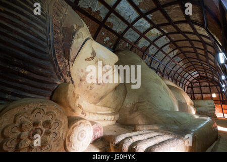 18-metre-long reclining Buddha statue from the 11th century inside the Shinbinthalyaung Temple in Bagan, Myanmar (Burma). Stock Photo