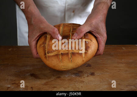 Breaking of a fresh loaf of Eucharistic bread in Zagreb, Croatia on September 21, 2016. Stock Photo