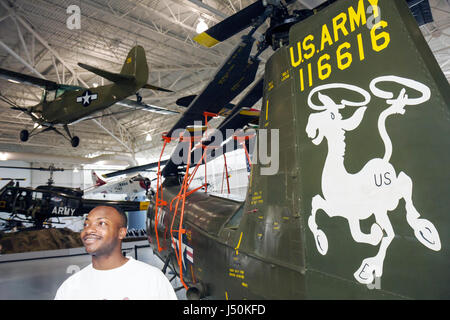 Alabama,Dale County,Ft. Fort Rucker,United States Army Aviation Museum,Black man men male adult adults,aircraft,military helicopters,combat,exhibit ex Stock Photo