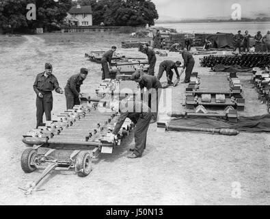 British soldiers preparing to loads bombs on to aircraft during world war Two. Stock Photo