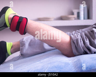 Physical therapy mecical clinic physiotherapy treatment for knee injury and rehabilitation after surgery. Stock Photo