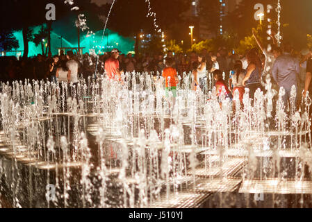 Lima, Peru- April 22, 2017: People playing with music show fountain in agua magico park Stock Photo