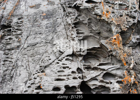 Interesting deposits, honeycomb weathering and coastal rock formations found on the cliff face of Blowhole Beach, Deep Creek Conservation Park, South  Stock Photo