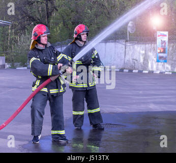Water extingisher in hands, close up view. Stock Photo