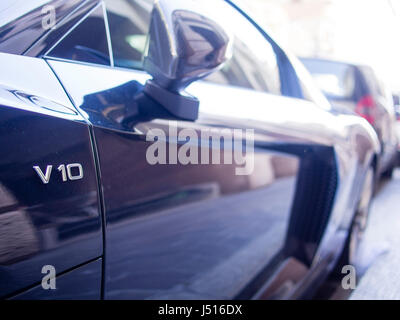 black Audi R8 V10 emblem with optical bokeh effect Stock Photo