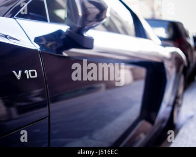 black Audi R8 V10 emblem with optical bokeh effect Stock Photo