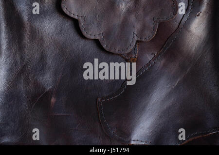 Surface seams and stitches of black leather. Stock Photo