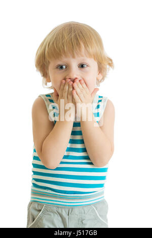 Surprised little boy with hands closed his face Stock Photo