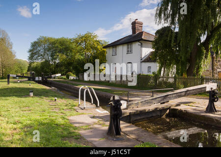 The 200 year old New Marton upper lock gates and lock keepers cottage on the Shropshire Union canal an idyllic view on the British inland waterways Stock Photo