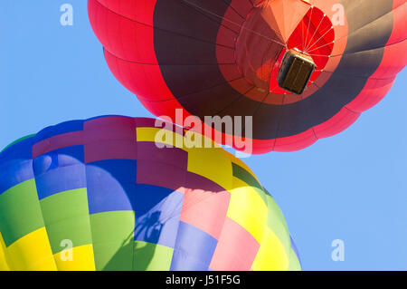 Two hot air balloons bumping each other as they lift off.  This image was taken during the Freedom Festival in Provo, Utah that occurs every July 4th Stock Photo