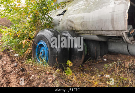 Mired in the mud of landing gear a large airliner on the ground Stock Photo