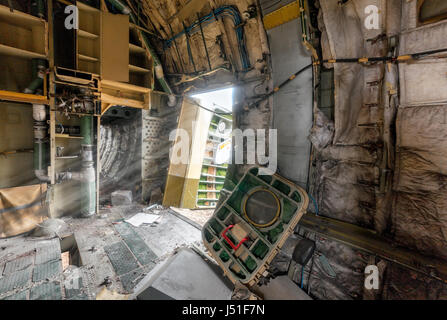Open the broken door of the aircraft, through which visible rays of light next to the detached door, inside view. Stock Photo