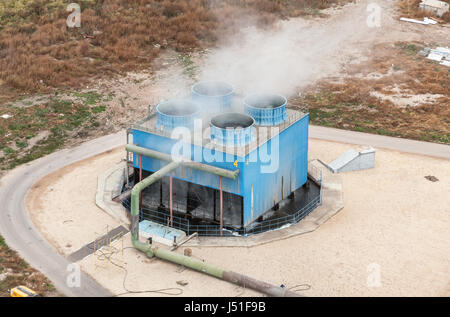 Blue industrial cooling tower at a chemical plant. Top view. Focus on the cooling tower Stock Photo