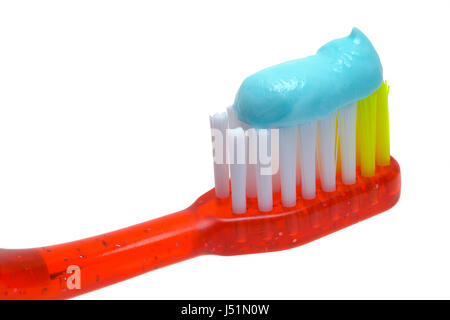Close Up of Red Toothbrush with Toothpaste Isolated on White Background. Stock Photo