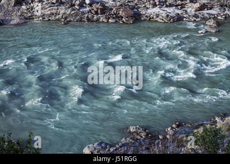 The flow of the great Ganges River near the city of Rishikesh. India Stock Photo