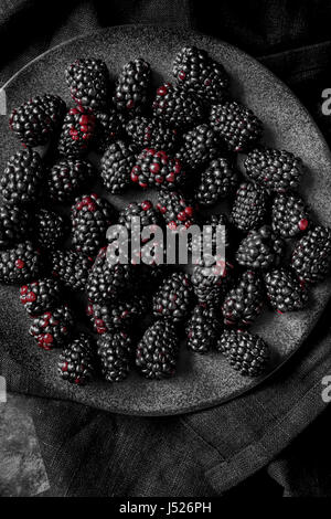 Blackberries on a dark plate Stock Photo