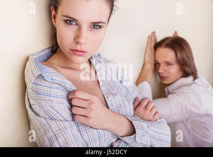 Couple in deep thought after a quarrel. The girl in the foreground Stock Photo