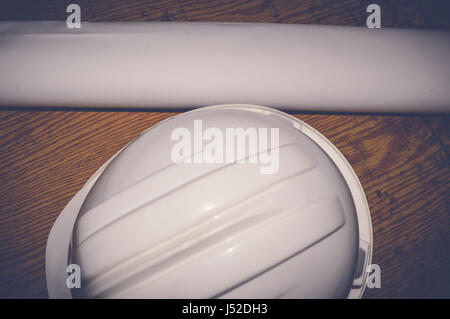 white safety helmet with drawings, engineering concept Stock Photo