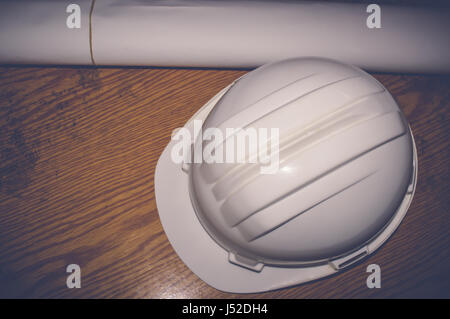 white safety helmet with drawings, engineering concept Stock Photo
