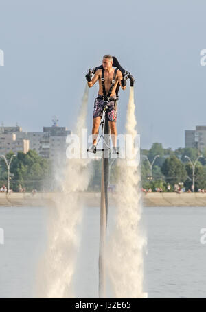 BUCHAREST, ROMANIA - SEPTEMBER 5, 2015. Acrobatic Jetsky pilot training on the lake. Aeronautic show. Stock Photo