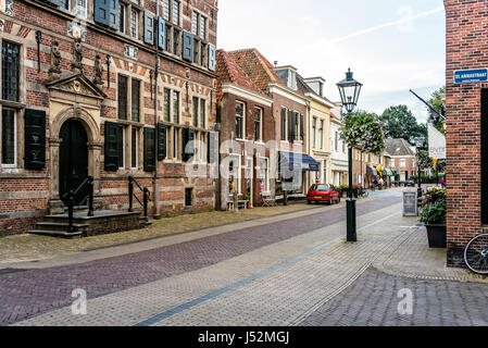 Naarden, Netherlands - August 5, 2016: Picturesque street in Naarden city centre. Naarden was developed into a fortified garrison town with a textile  Stock Photo