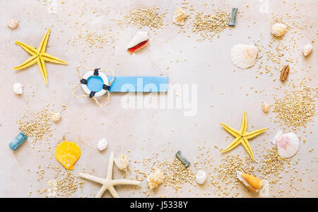 Sea shells with sand and  marine items as background. Top view, vintage toned image, blank space Stock Photo