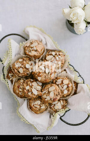 A basket full of parsnip morning glory bran muffins are photographed from the top view. Stock Photo
