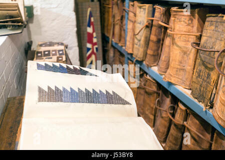 19th century books of textile samples in Cotswold Woollen Weavers, Filkins, Oxfordshire, England, UK Stock Photo